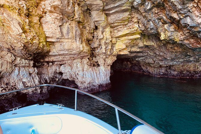 Boat tour of the Polignano a Mare caves with aperitif - Grotta Palazzese: The Restaurant Cave and the “Pebble Beach” Detail