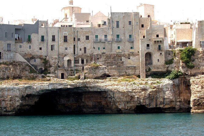 Polignano a Mare boat tour emotions, caves, diving and appetizers - Lama Monachile and the on-board aperitivo toast