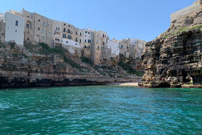 Tour of Polignano a Mare in Ape Calessino - Statue of Domenico Modugno and Marquis Arch: quick landmark hits